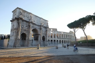 Arch of Constantine and Colosseum at sunrise, Rome, Lazio, Italy