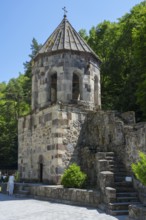 Stone bell tower with stairs in a wooded area, Chitakhevi Church of St. George, The Green