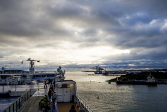 Dramatic sunset over the water with harbor and ships, taken by the Stena Line Göteborg-Kiel ferry,
