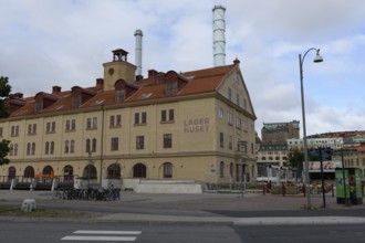Historic warehouse building with distinctive chimneys in the city area, Gothenburg, Västra