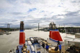 View from ship deck of a bridge and surrounding countryside on a cloudy day, Stena Line