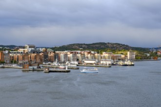 Panorama of a harbor with municipal buildings and cloudy sky in the background in Gothenburg, Stena