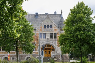 Folksbibliotek Historical Library in Götenborg with Gothic style, surrounded by trees with green