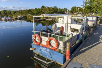 Small boat that connects Ekenäs in Lake Vänern with the Lurö Archipelago in a quiet harbor with