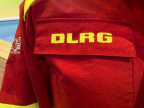 Press photo of DLRG logo on combat clothing from Deutsche Lebens-Rettungs-Gesellschaft e.V.,