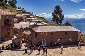 A picturesque village in the Andes with traditional buildings surrounded by mountains and clear