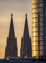 Cologne Cathedral, church towers, round façade of the Cologne Triangle Hochaus in Cologne-Deutz,