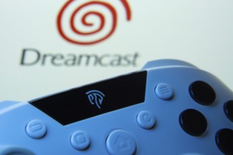 Dhaka, Bangladesh- 24 Mar 2025: A close-up of a gamepad with the Dreamcast seen on screen in the
