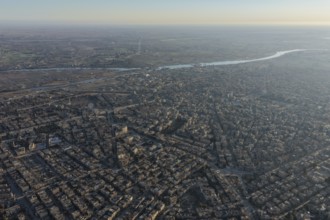 In Deir ez-Zor, Eastern Syria on January 21, 2026, an aerial drone shot captures the city landscape