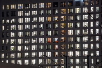 Office building, many windows are illuminated, Cologne, North Rhine-Westphalia, Germany