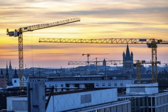 View of downtown Cologne, construction cranes from various construction sites, tower of Groß St.