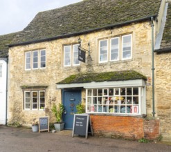 National Trust shop in historic Cotswold stone building, village of Lacock, Wiltshire, England, UK