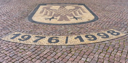 Brandenburg coat of arms on paving stone, sidewalk in front of the Brandenburg Gate in Potsdam,