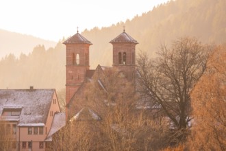 Church towers and buildings in a snowy village near Bergen, Black Forest, Germany
