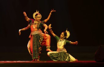 Artists perform Odissi classical dance during a cultural evening program at Shilpgram Mohotsav 2026