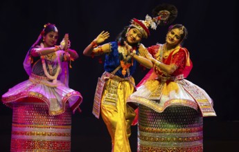 Artists perform classical Manipuri Ras Leela during a cultural evening program at Shilpgram