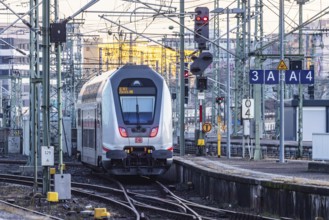 InterCity IC to Zurich leaving Stuttgart Central Station in the morning. Rail signals and overhead