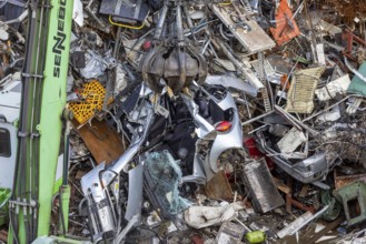Scrap trade in a commercial port. A disused small car is scrapped. Mannheim, Baden-Württemberg,