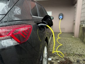 An e-car is charged at a wallbox, Wuppertal, Germany