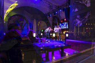 View of a karaoke bar at night, Krakow, Poland