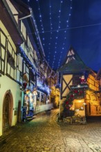 Houses illuminated and decorated for Christmas, Christmas market, blue hour, Eguisheim, Haut-Rhin