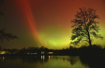 Northern lights, northern lights, on a lake in Schleswig-Holstein, Germany