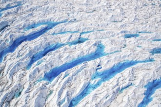 Aerial view of meltwater on the Greenland ice sheet, Arctic landscape, frozen wilderness, glaciers
