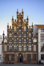 Historic brick Gothic buildings on the market square of the Hanseatic City of Greifswald,