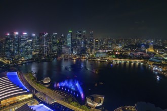 Aerial view from Marina Bay Sands SkyPark Observation Deck over the illuminated skyline of the city