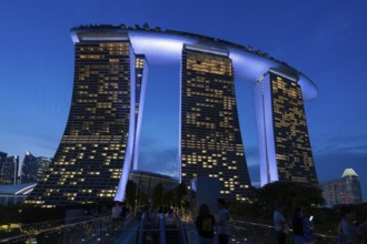 Marina Bay Sands, MBS, luxury 5-star hotel and integrated resort illuminated at dusk in Downtown