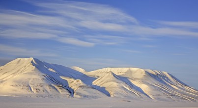 Snow covered mountain Operafjellet, Opera Mountain on the north side of Adventdalen near