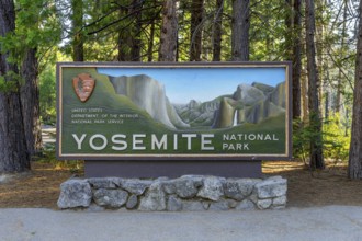 Entrance sign to Yosemite National Park, managed by the NP Service in the Sierra Nevada mountain