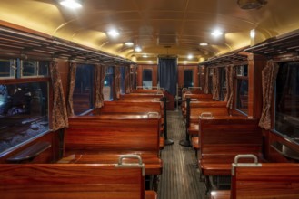 Interior of 1939 railcar, motor car Type 551 with wooden benches at Train World, railway museum in