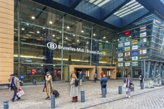 Entrance and travelers, commuters, tourists leaving the NMBS Brussels-South railway station, Gare
