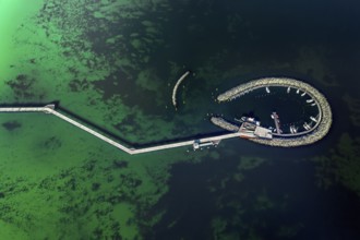 Aerial view over Seebrücke, pier and marina with boats at seaside resort Prerow along the Baltic