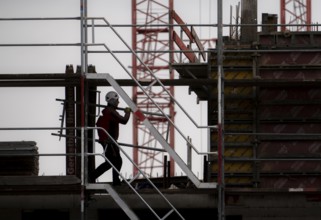 Construction site, scaffolding work on a large construction project, apartments and commercial