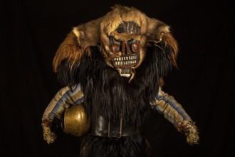 Portrait of traditional hand-carved wooden mask from the Loetschental Carnival, representing