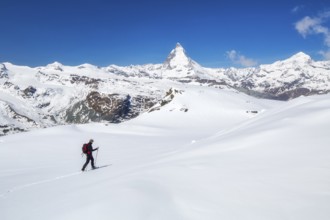 Snowshoeing in the Gornergrat region with views of the surrounding mountains and the Matterhorn,