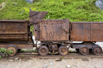 Old rusted mine trucks from the former Gold Mine Independence Mine in mountainous landscape,