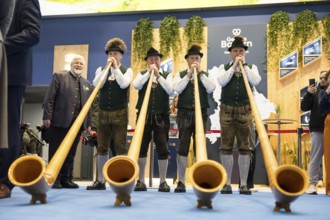 Alphorn wind players at the Bavarian stand during the opening tour of the Green Week at the