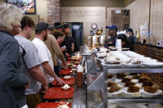 People stand in line at Arnold's Country Kitchen in Nashville, Nashville, Tennessee, USA