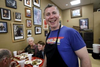 Friendly host laughs at Arnold's Country Kitchen in Nashville, Nashville, Tennessee, USA