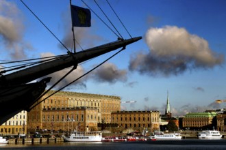 Royal castle in Gamla Stan seen from Skeppsholmen, with dramatic sky and clouds, Stockholm, Gamla