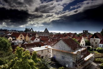 Clouds rolling over the red roofs of the historic old town, Visby, Gotland, Sweden