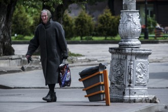 Old man walking across a street in Tilsit, Sovetsk, Tilsit, Russia