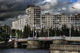 Large residential building with river and bridge in the foreground, Kaliningrad, Russia