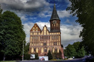 Majestic cathedral with impressive tower against blue sky, Kaliningrad, Russia