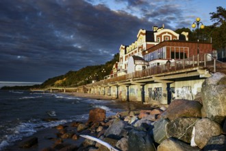 Promenade on the beach at dusk with coastal houses, Svetlogorsk, Kaliningrad, Russia