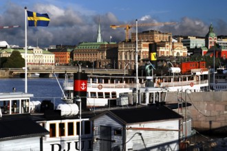 Distinctive features of Stockholm's waterways with shipping traffic and views over Strömgatan,