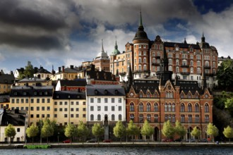 Historic buildings of Södermalm, Stockholm viewed in dramatic light from Riddarholmen, Stockholm,